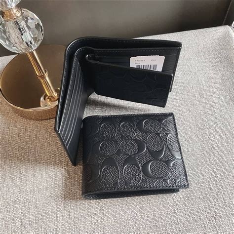 men coach wallet price check